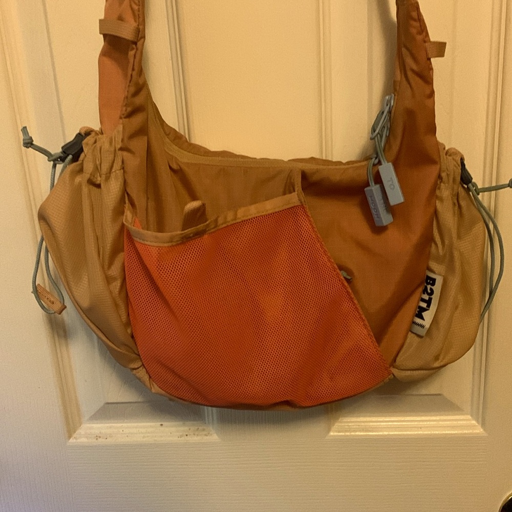 Baboon to the Moon Crescent Crossbody Bag in Desert Brown